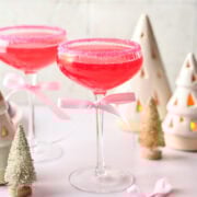 Front view of pink cocktail in a coupe glass.