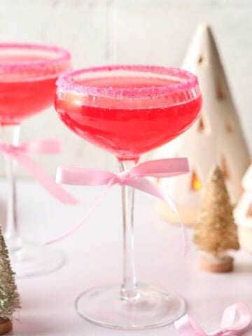 Front view of pink cocktail in a coupe glass.