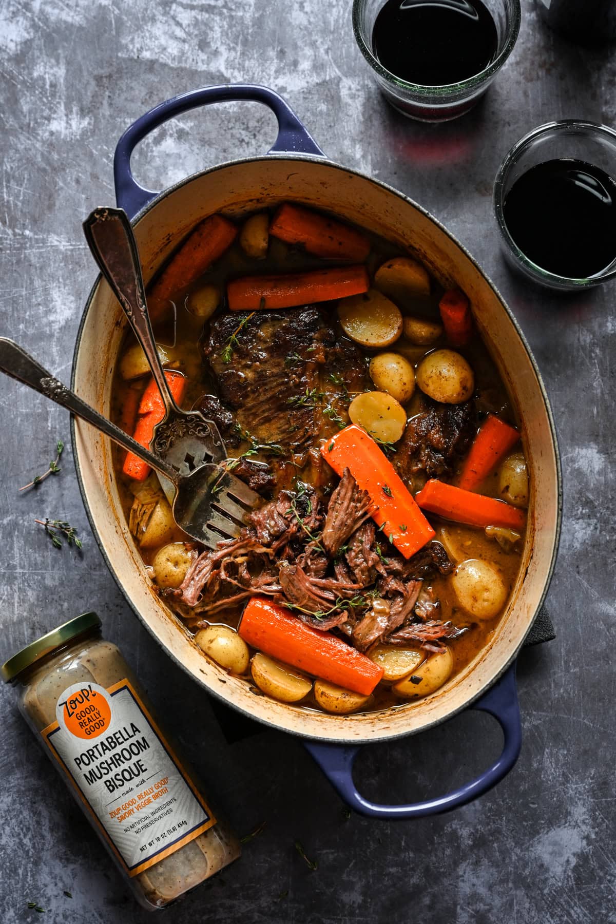 Overhead view of pot roast next to a jar of mushroom soup.
