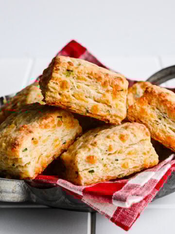 Front view of biscuits on a red checkered cloth.