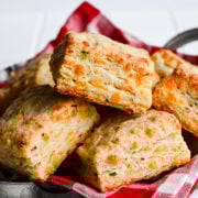 Front view of biscuits on a red checkered cloth.