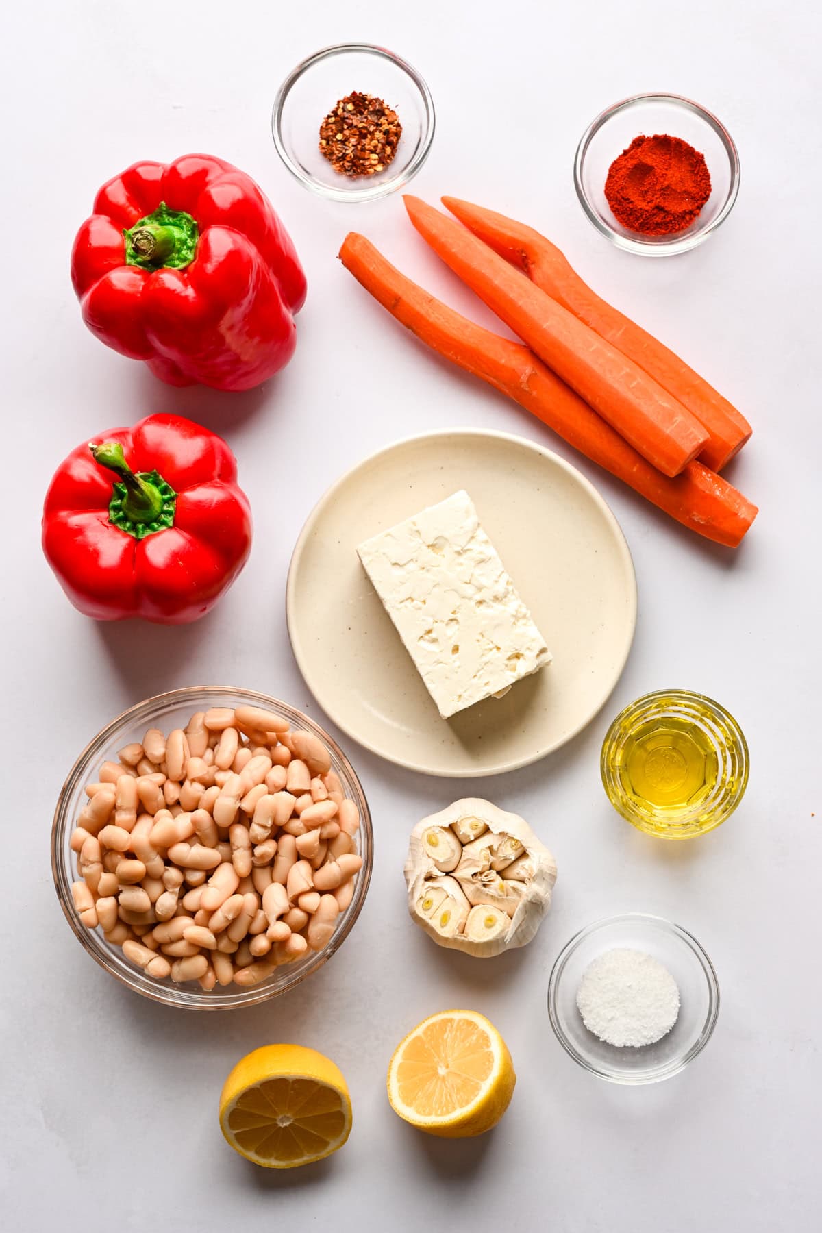 Overhead view of ingredients for carrot and roasted red pepper feta dip.