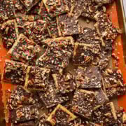 Overhead view of bourbon pecan christmas crack on a sheet pan.
