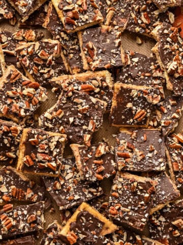 Overhead view of bourbon pecan christmas crack on a sheet pan.