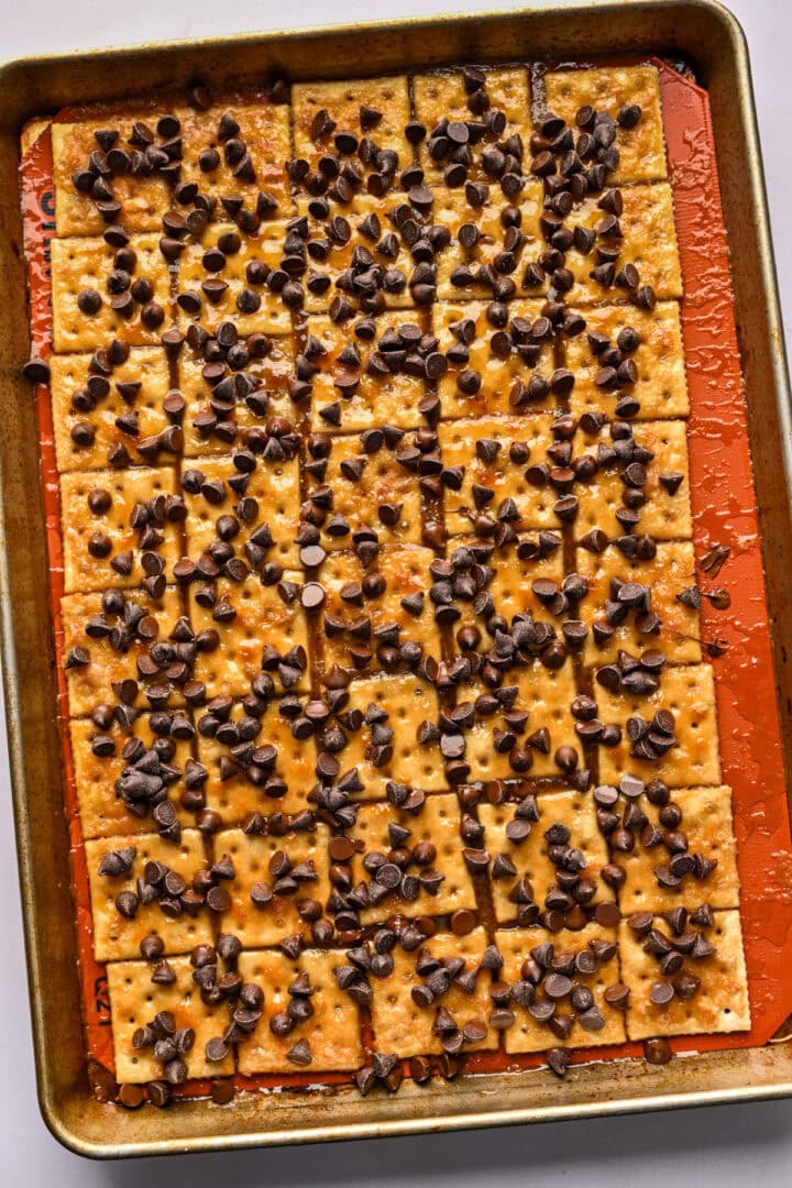 Chocolate chips sprinkled over bourbon toffee.