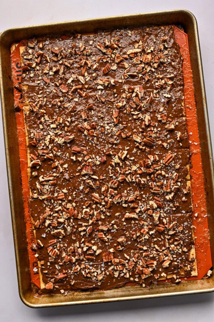 Finished bourbon pecan christmas crack on sheet pan.