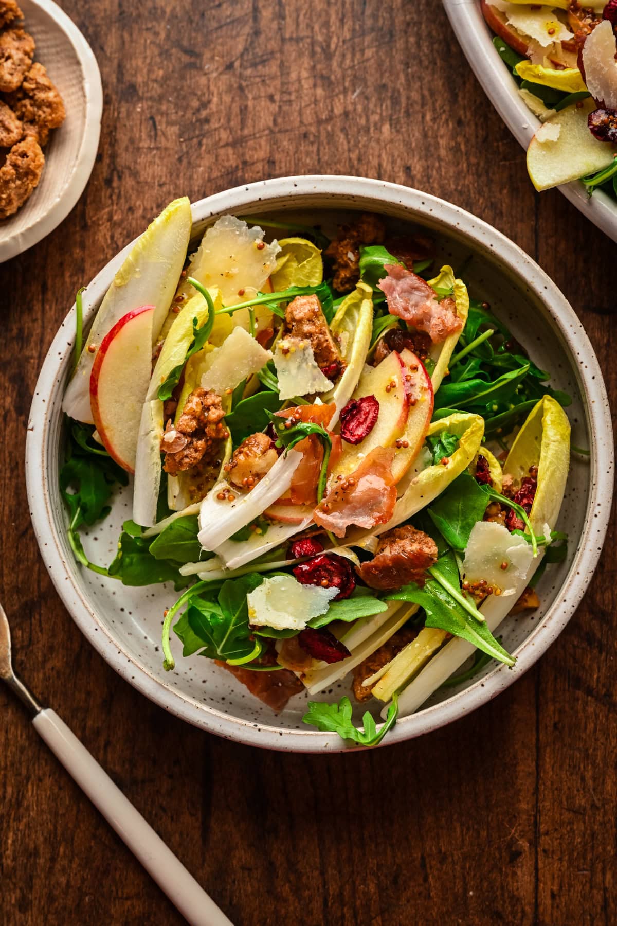 Endive and candied walnut salad in a bowl.