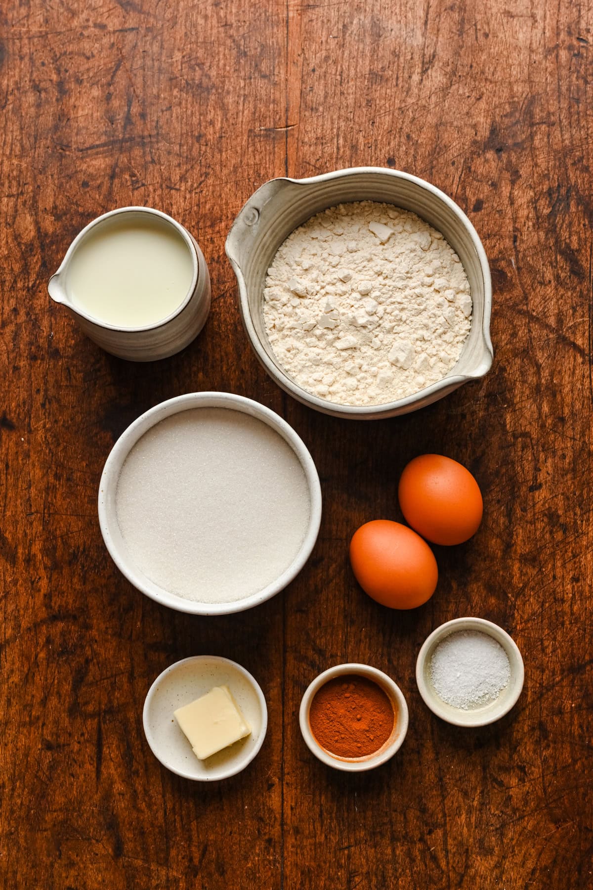 Overhead view of popover ingredients, including eggs and milk.