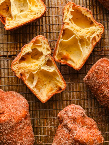 Overhead view of several popovers, some of which are cut in half.