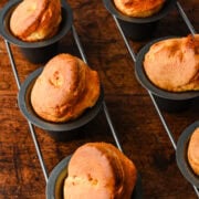 Close up view of several popovers in a popover pan.