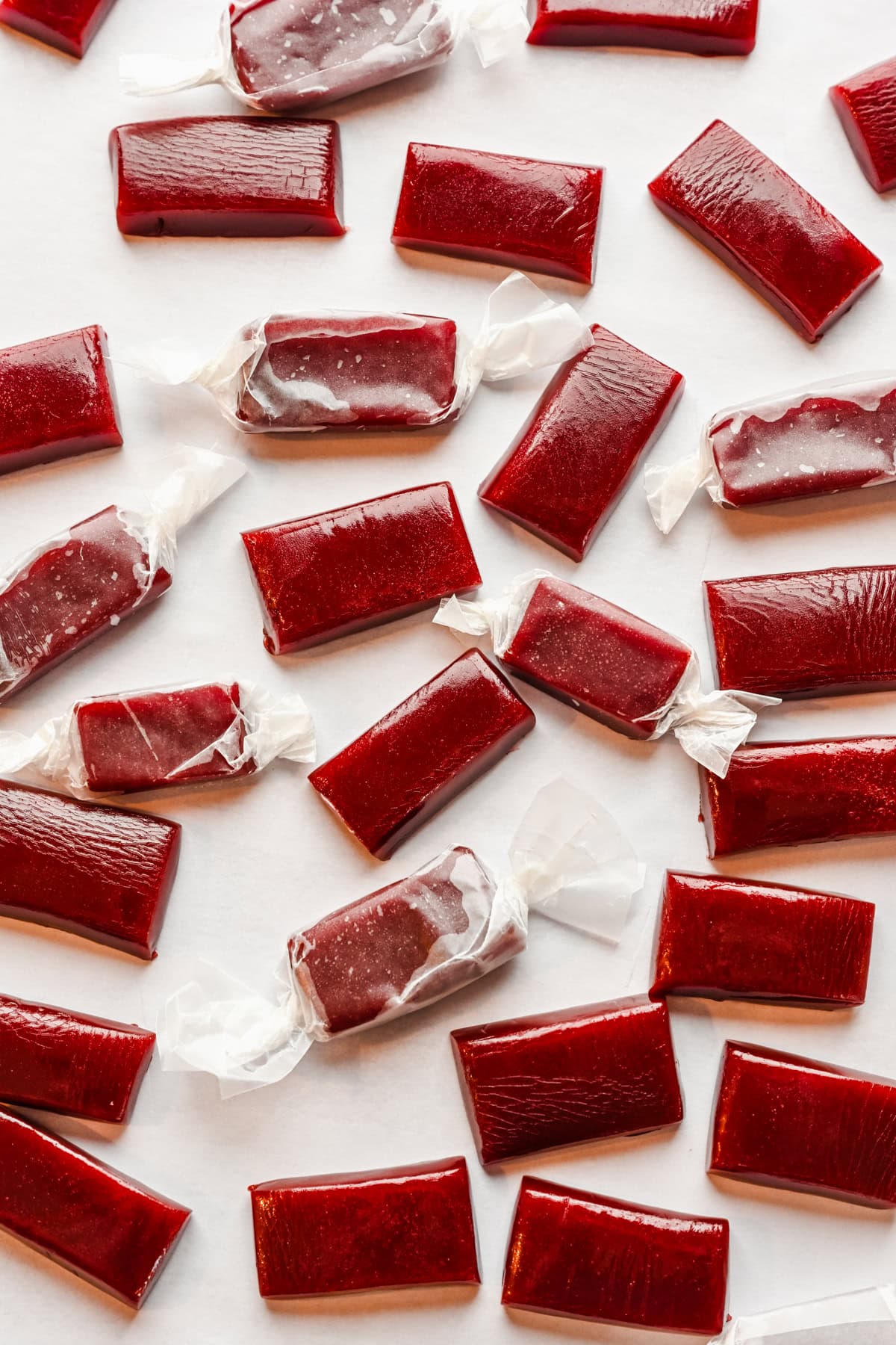 Pomegranate caramels wrapped in wax paper.