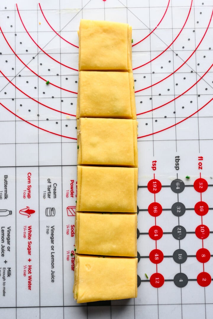 Stacked dough strips cut into 6 portions.