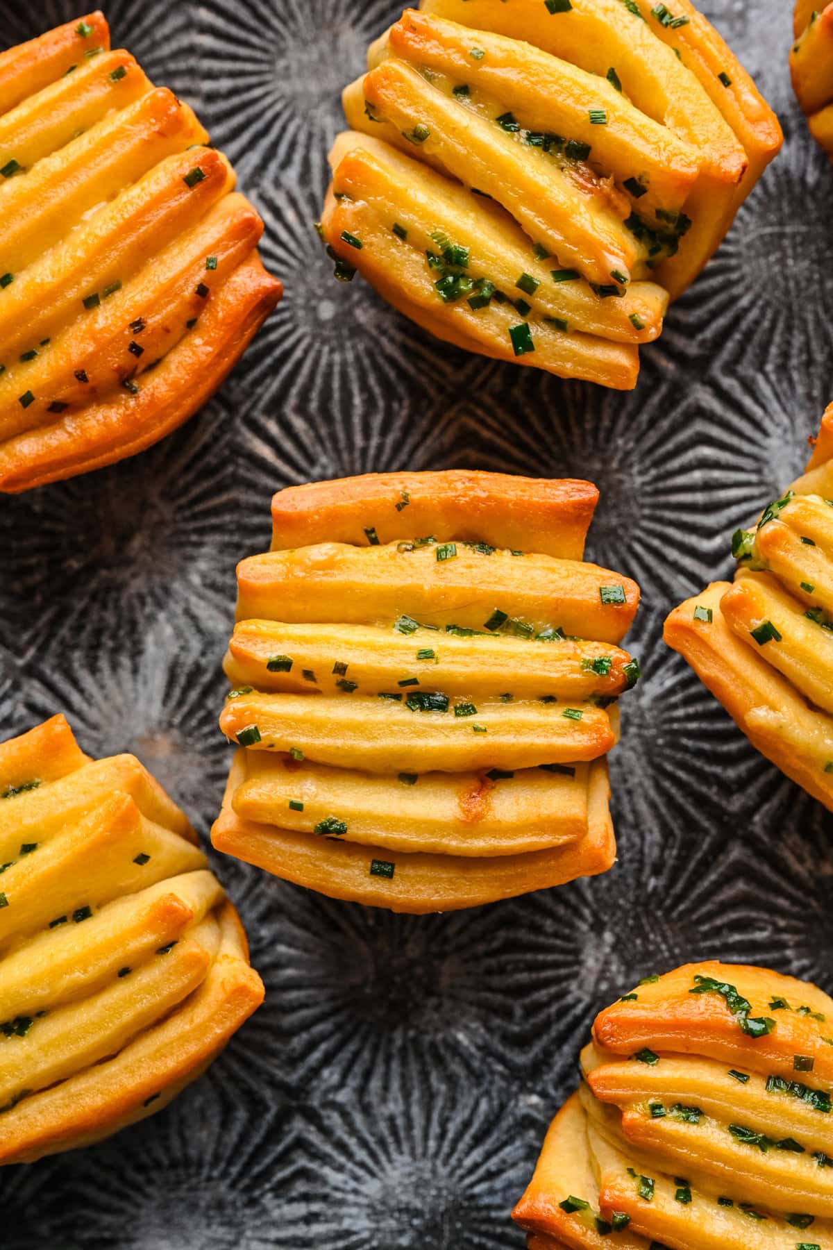 overhead view of garlic herb butter fan rolls.