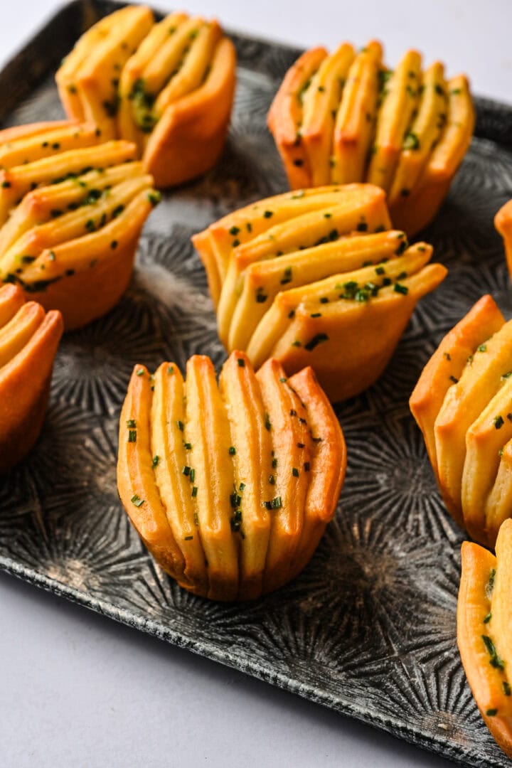 side view of garlic herb butter fan rolls.