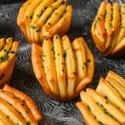 side view of garlic herb butter fan rolls.