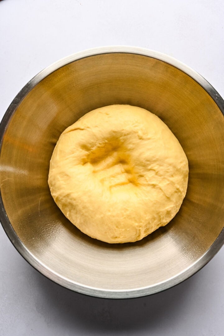 fan roll dough after rising, punched down in bowl.