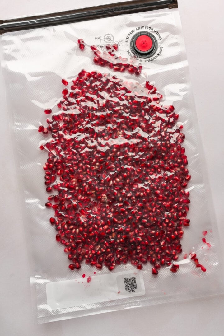 overhead view of pomegranate arils in a bag. 