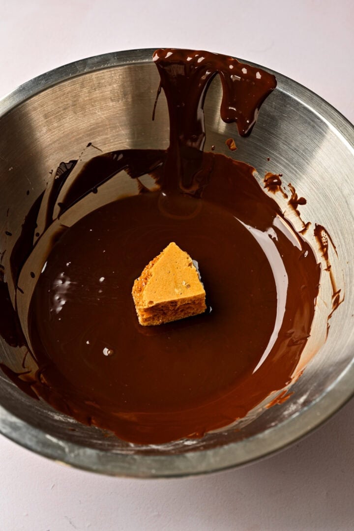 before coating piece of honeycomb in chocolate. 