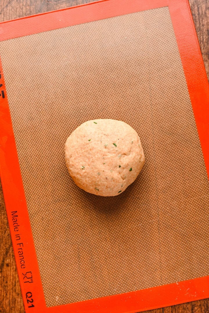 Dough ball resting upon a silpat.