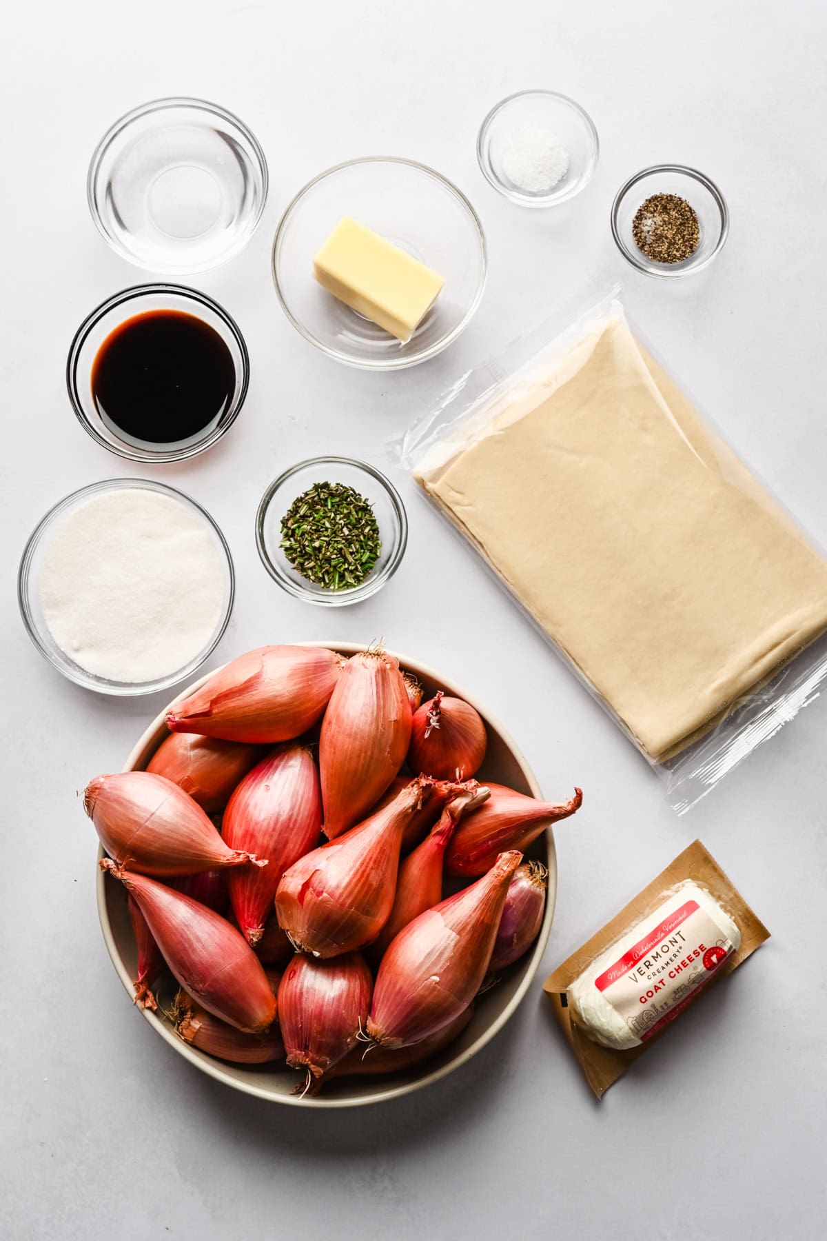 Overhead view of ingredients for onion tarte tatin.