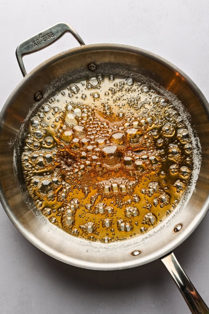 Golden brown caramel in a skillet.