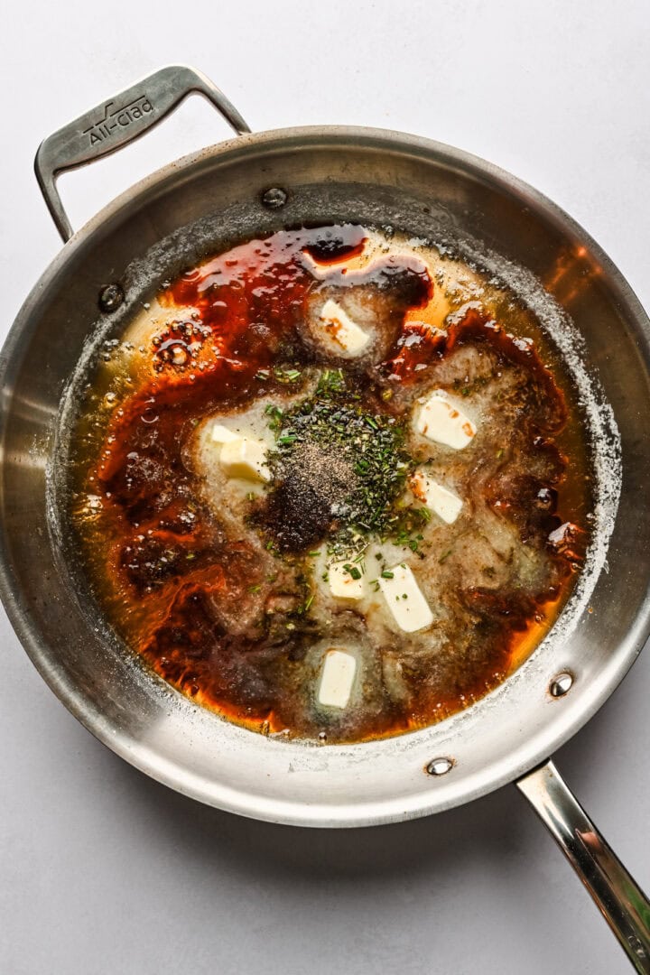 Balsamic caramel ingredients in a skillet before melting.