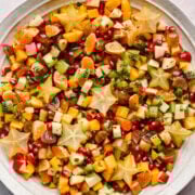 Overhead view of winter fruit salad in a large bowl.