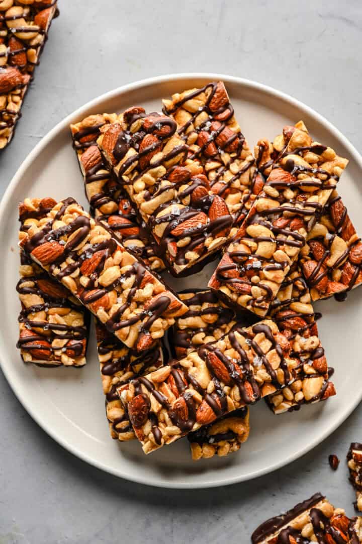 Overhead view of nut bars on a plate.