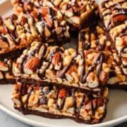 Overhead view of nut bars on a plate.