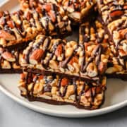 Overhead view of nut bars on a plate.