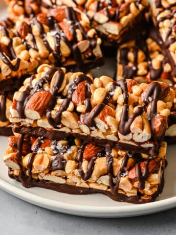 Overhead view of nut bars on a plate.