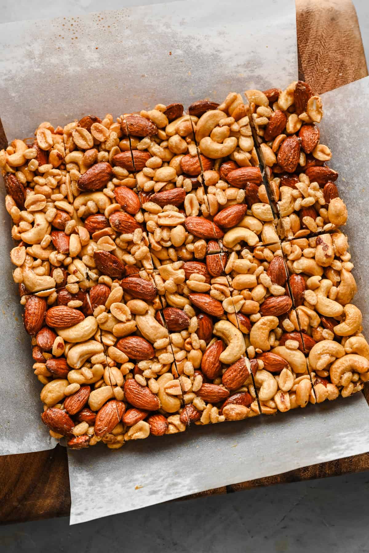 Cutting 8x8 nut bar square into individual bars.