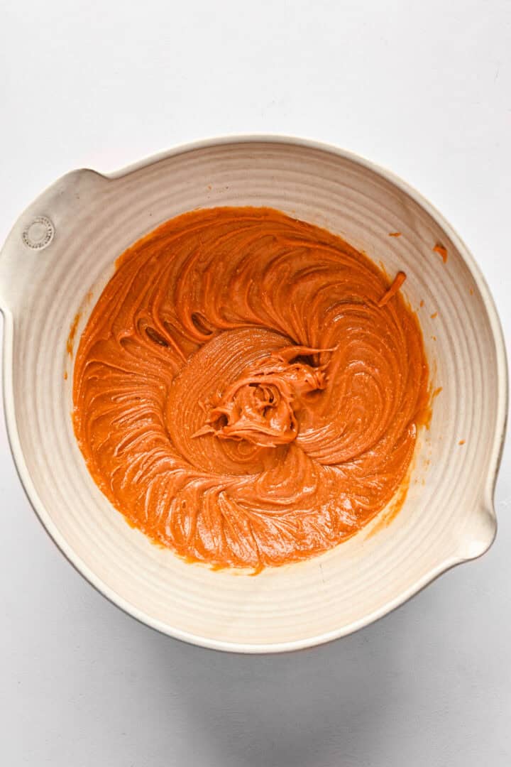 Overhead view of whipped peanut butter, vanilla, and salt.