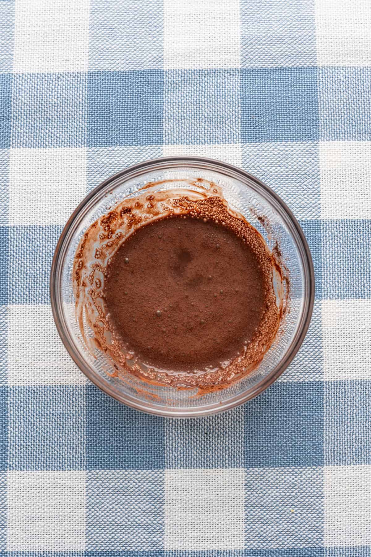 cocoa powder and water mixed together in a small bowl.