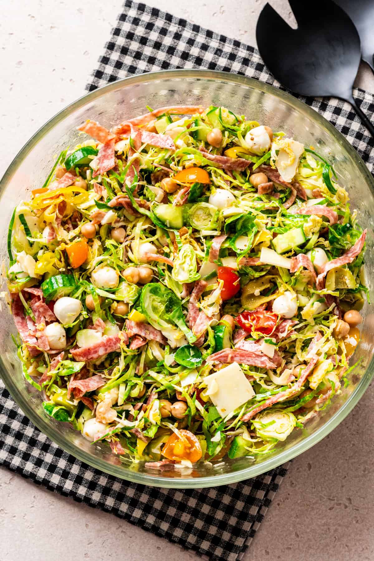 Italian chopped salad with shaved brussels sprouts in a large bowl.