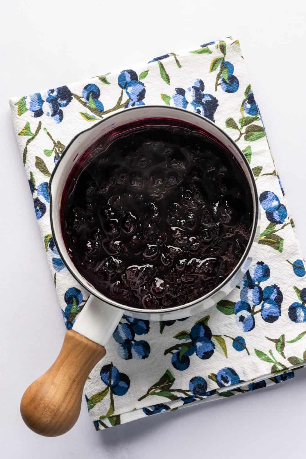 Blueberry lemon compote ingredients in saucepan after cooking. 