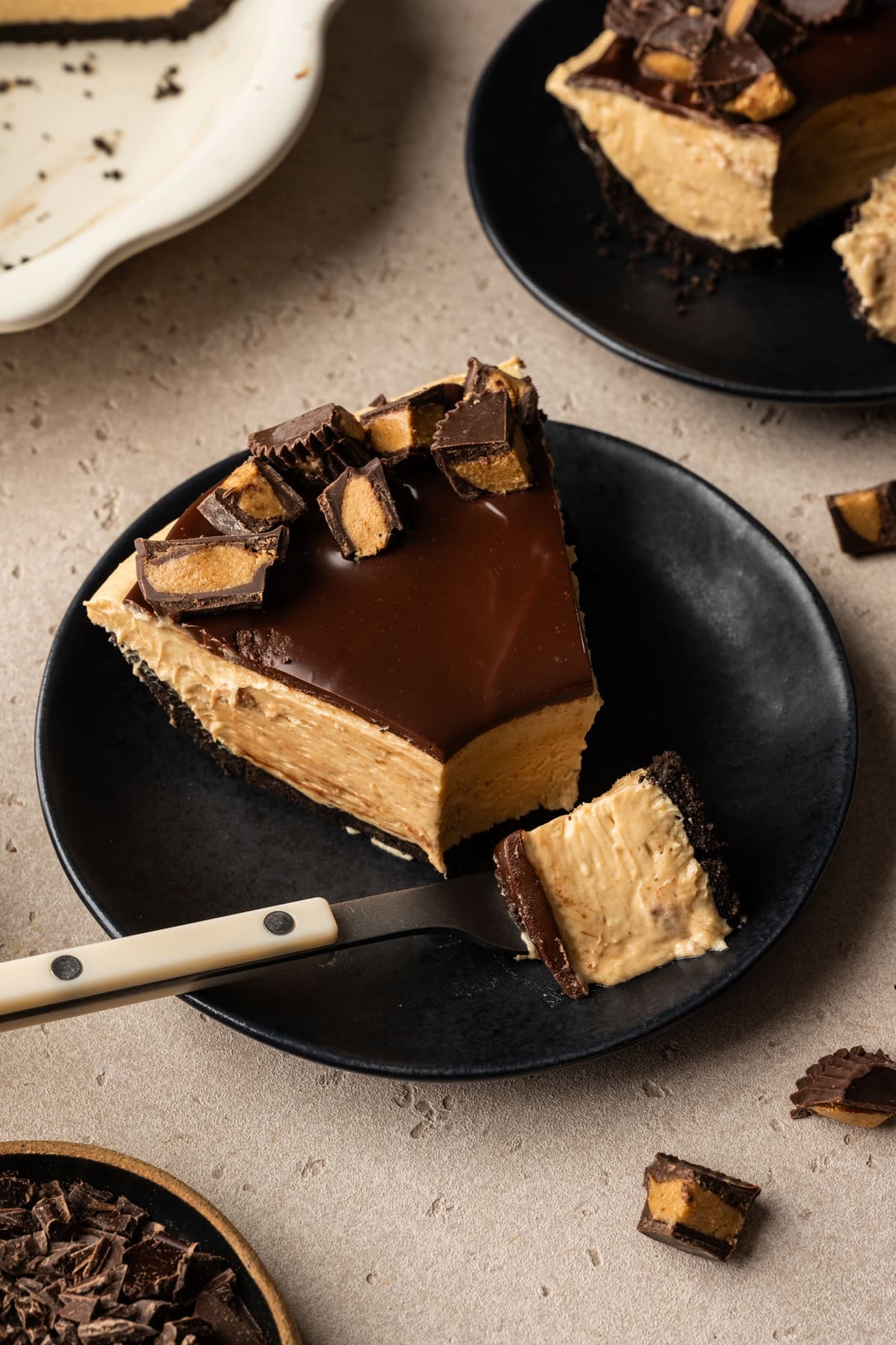 Close up view of a slice of peanut butter mousse pie.
