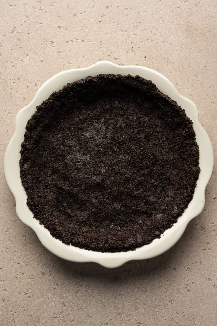 Oreo crust pressed into pie pan.