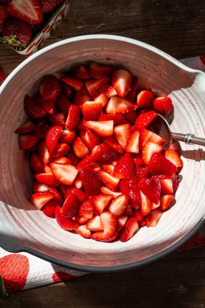 Strawberries in bowl after macerating. 