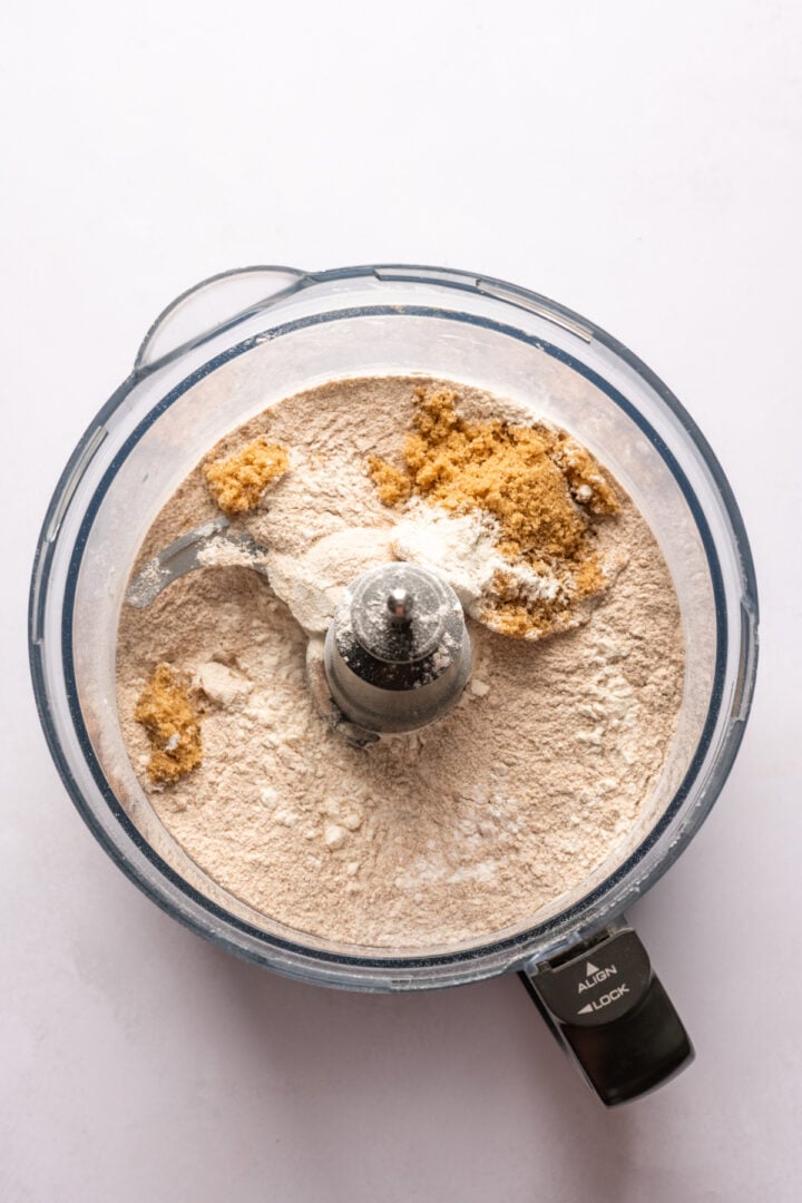 overhead view of dry ingredients in a food processor. 