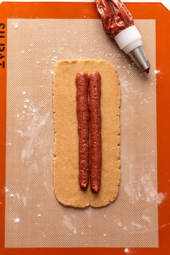 Nutrigrain bar dough rolled out into a rectangle with strawberry filling piped into the center.