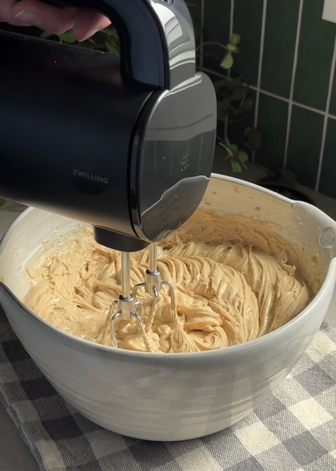 Hand mixer in bowl of peanut butter mousse. 