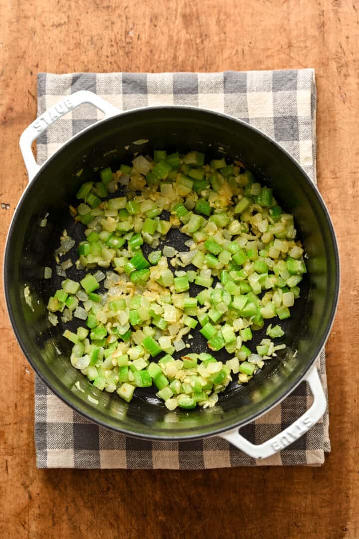 Sauteed onion, garlic and celery in a cast iron pot. 