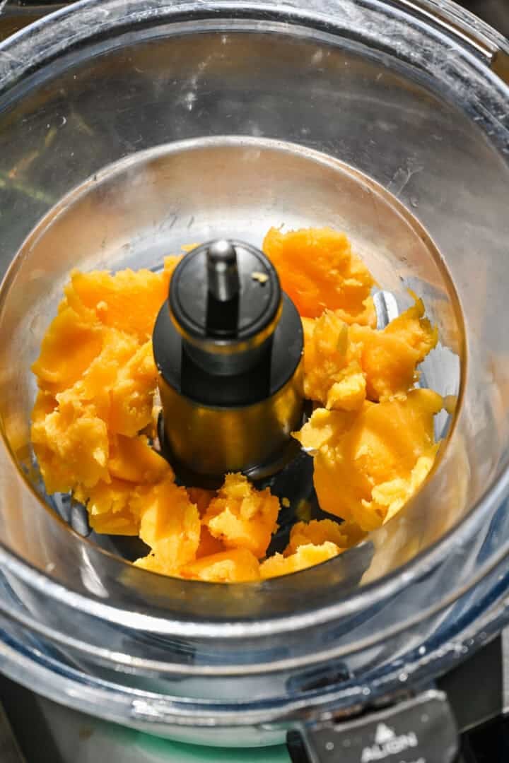 Homemade cheese spread in food processor before blending.