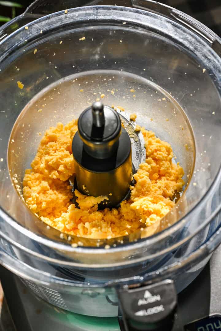 Homemade cheese spread in food processor after blending.