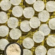 Overhead view of rice crackers on a cooling rack.