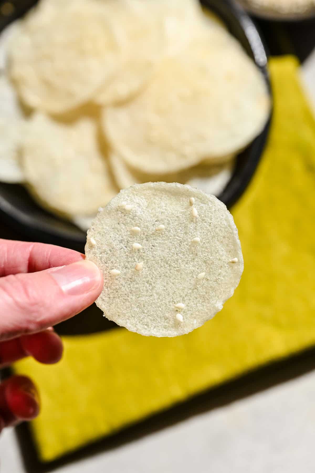 Overhead view of rice cracker in hand.