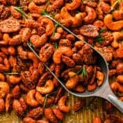 Overhead view of roasted nuts on a sheet pan.