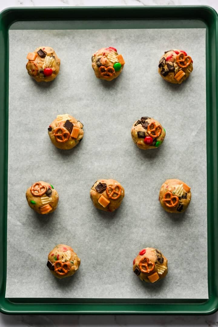 Overhead view of cookies on a baking sheet before baking.