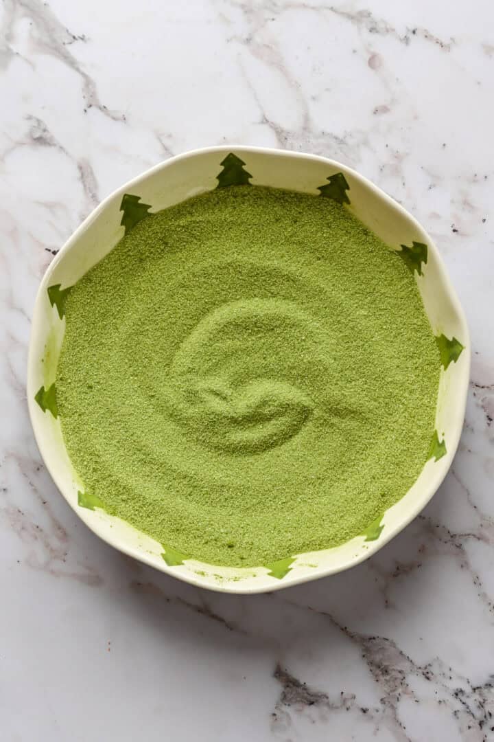 Matcha and sugar mixed together in a bowl.